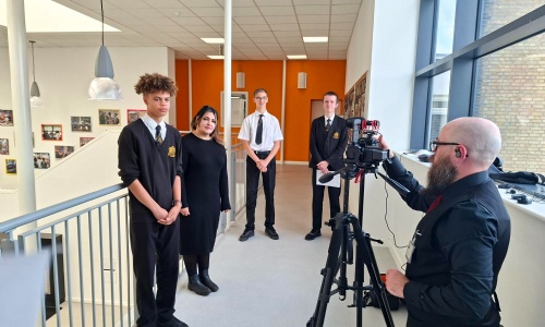 Students being interviewed in front of video camera
